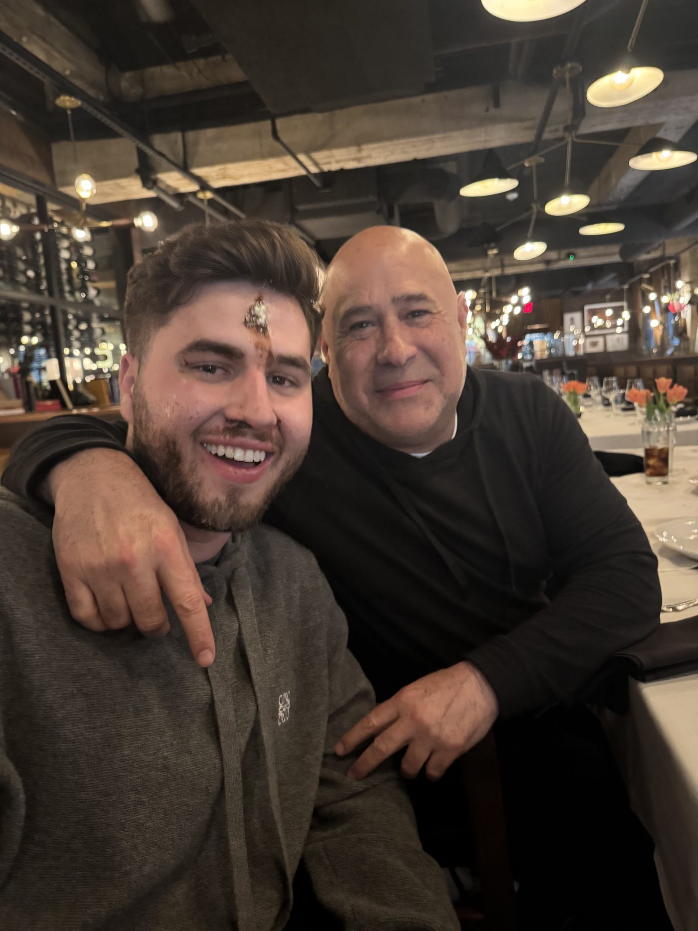 Aaron and his son at dinner