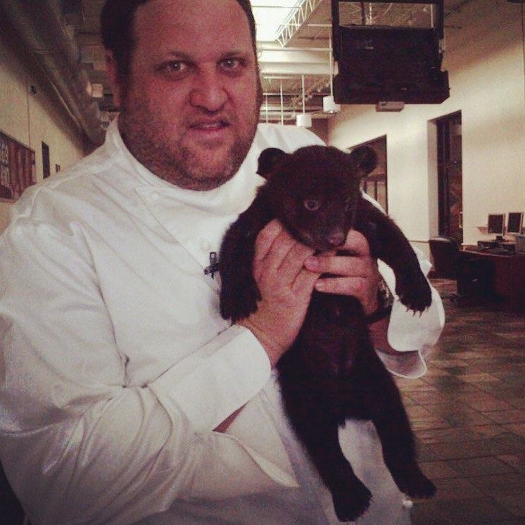 Aaron with a bear cub