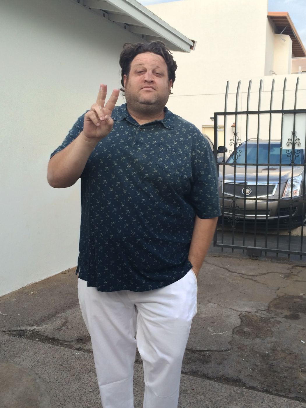 Aaron throwing a peace sign